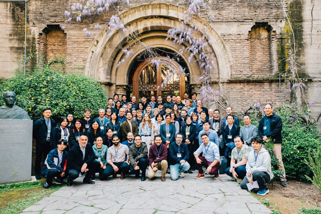 A group photo from the EMTP workshop in Santiago, Chile. The image is taken outside, in front of what appears to be a historic building.