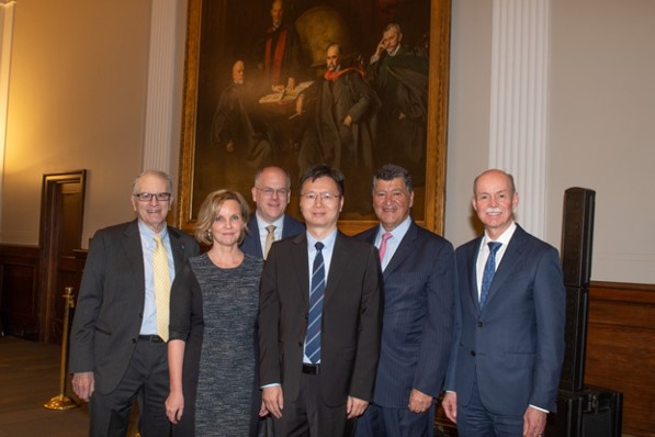 Dr. Hanzhang Lu stands in a group photo with five other individuals after receiving the Elias A. Zerhouni Professorship.