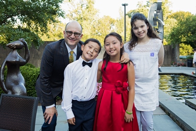 Bradley L. Schlaggar, MD, PhD, president and CEO of Kennedy Krieger; Matthew Schneider; Maggie Schneider; and Lena Schlaggar at the reception following Maggie and Matthew’s 2019 benefit concert.