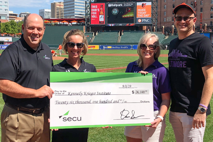 Left to right: David Sweiderk, president and CEO of SECU; Sarah Ryan, director of the SECU MD Foundation; Jen Doyle, director of leadership giving for Kennedy Krieger; and Dr. Bradley L. Schlaggar, president and CEO of Kennedy Krieger