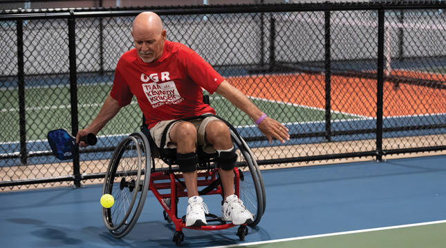 A male adaptive athlete participates in the Pickleball for All tournament.
