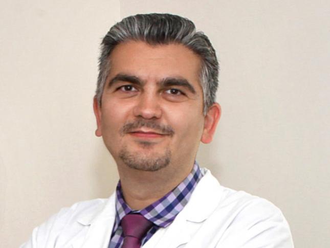 A headshot of Dr. Ali Fatemi