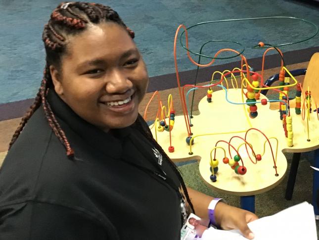 A photograph of Lauryn, a Project SEARCH intern, hard at work