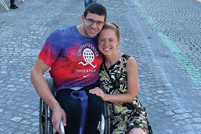 Daniel Romanchuk and a woman smile.