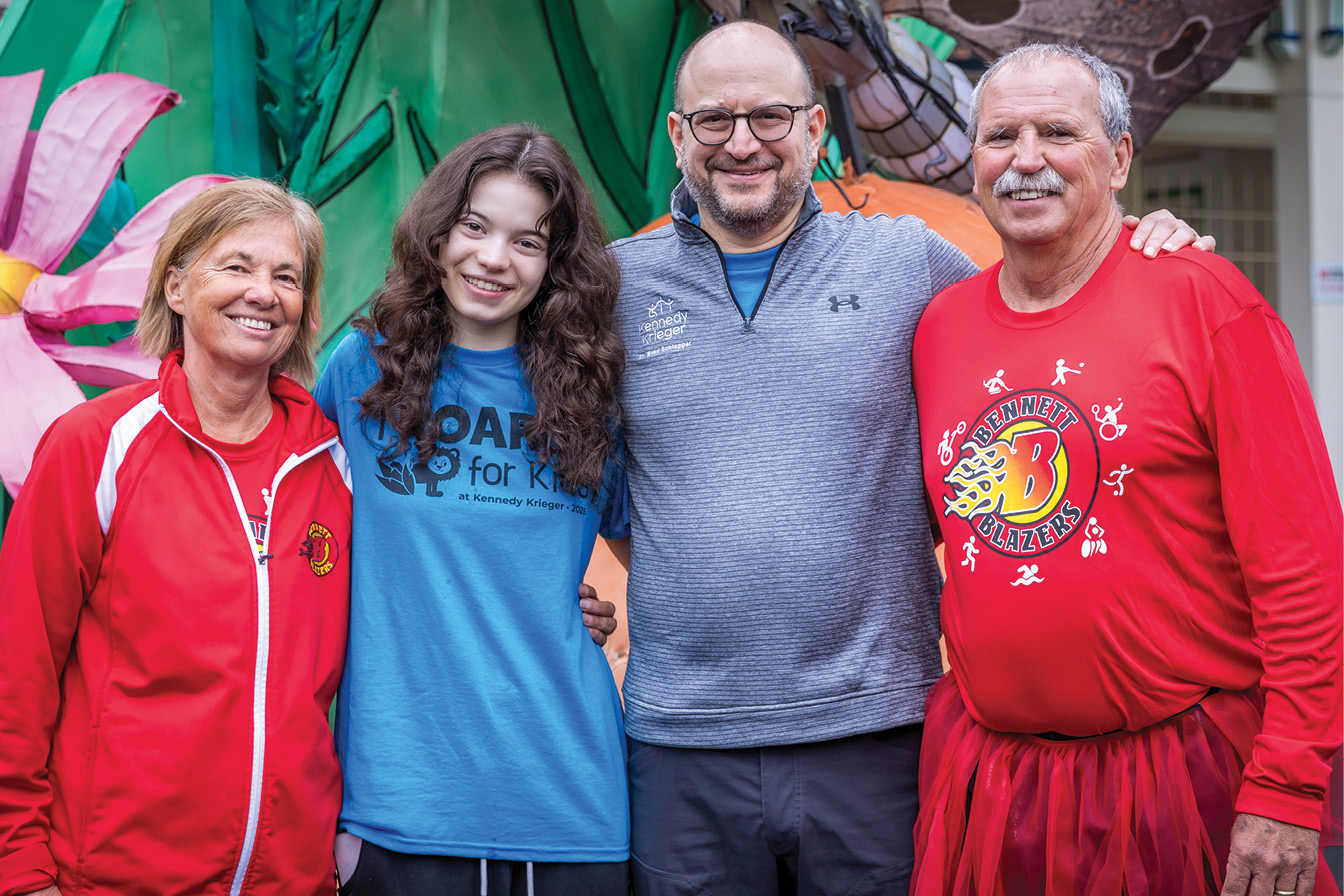 Dr. Bradley L. Schlaggar, president and CEO of Kennedy Krieger (right of center), with his daughter, Lena Schlaggar (left of center), and Gwena (far left) and Gerry (far right) Herman, co-directors of the Bennett Blazers, Kennedy Krieger’s adaptive sports program for kids and teens, at the Institute’s annual ROAR for Kids fundraising event last spring.