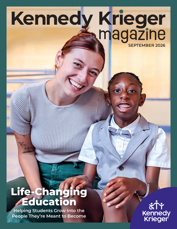 Cover of the September 2026 issue of Kennedy Krieger Magazine, featuring a student and teacher smiling in a classroom.