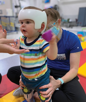 Matias during a physical therapy session at Kennedy Krieger.