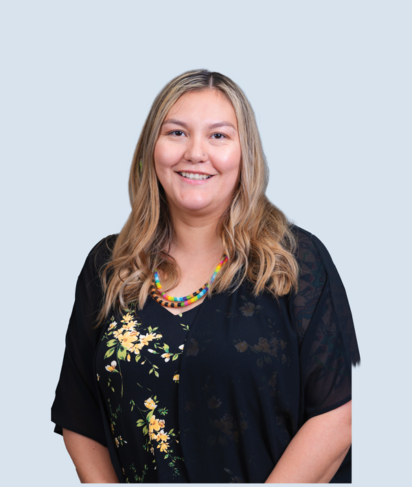 Posed photo of a smiling woman.