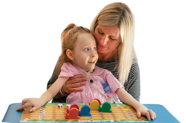 A photo of Ava working with physical therapist Kimberly Peterson.