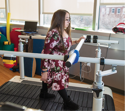 Shannon uses a split treadmill to practice walking.