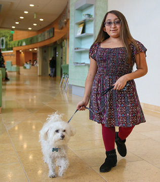 Shannon and Frosty, Shannon’s service dog, at Kennedy Krieger.