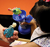 Sariyya plays with toys specially modified by her occupational therapist