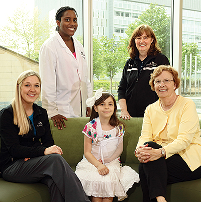 Kat, surrounded by some of the members of her care team: from left to right, child life specialist Shereé Sheffer, pediatric neurologist Dr. Eboni Lance, occupational therapist Gayle Gross and educational specialist Patty Porter.