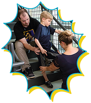 Sebastian works on using his right hand again with Shannon Iuculano, his occupational therapist.