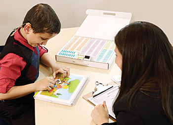 Mustafa zips through a nonverbal reasoning task during an evaluation with Dr. Plotkin.