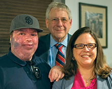 Dr. Goldstein (center) with Paul Siegel (left) and Dr. Anne Comi.