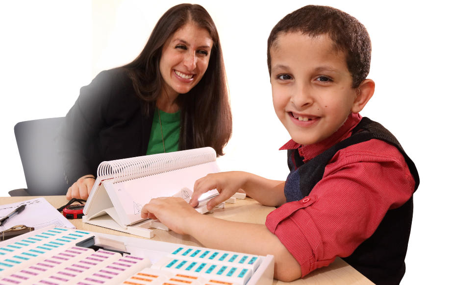 A Kennedy Krieger student and his teacher.