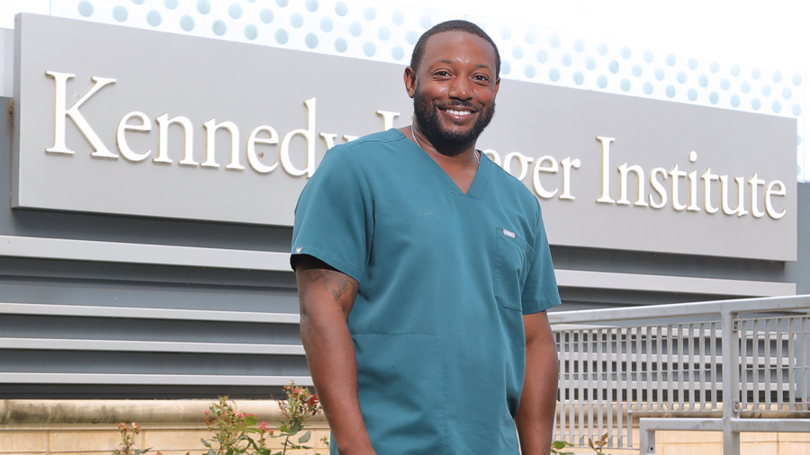 Patrick Oliver stands outside Kennedy Krieger Institute