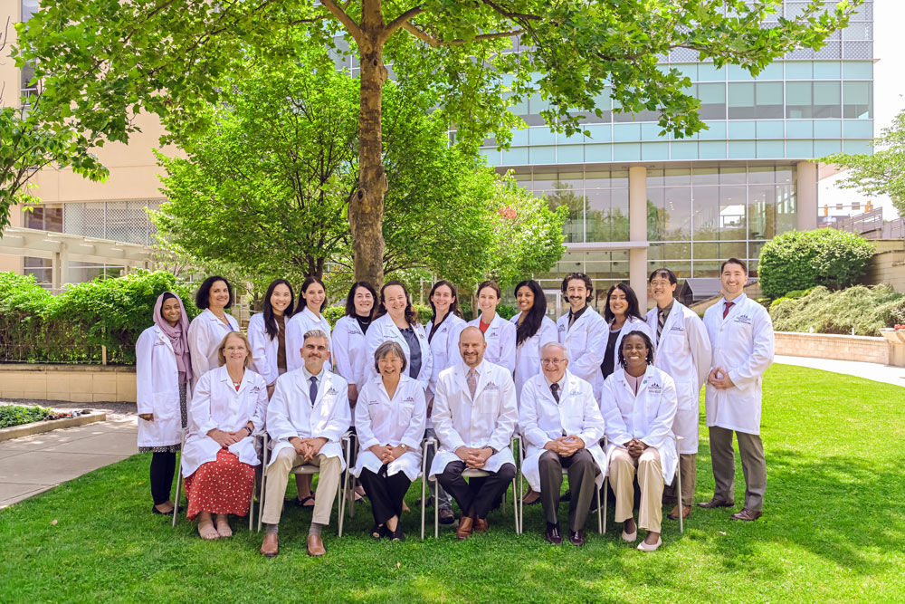 Group photos of NDD faculty members. The photo is staged in Kennedy Krieger's outdoor Therapy Garden.
