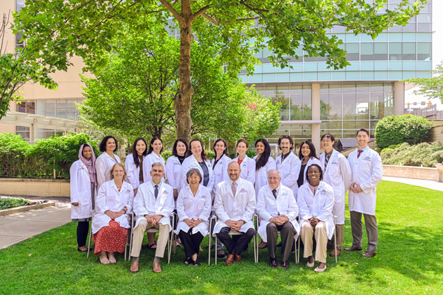 Group photos of NDD faculty members. The photo is staged in Kennedy Krieger's outdoor Therapy Garden.