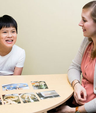 A speech language pathologist and her patient.