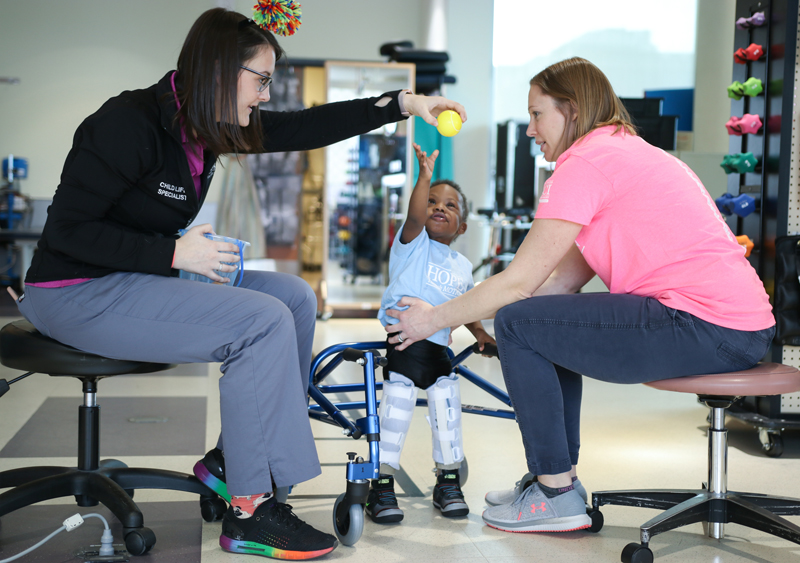 A patient receives therapy from members of the International Center for Spinal Cord Injury. 