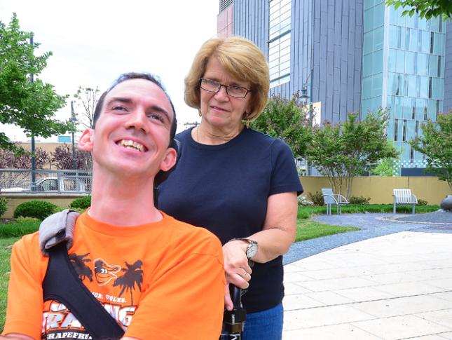 A photo of Kevin DiLegge and his mom on a sidewalk