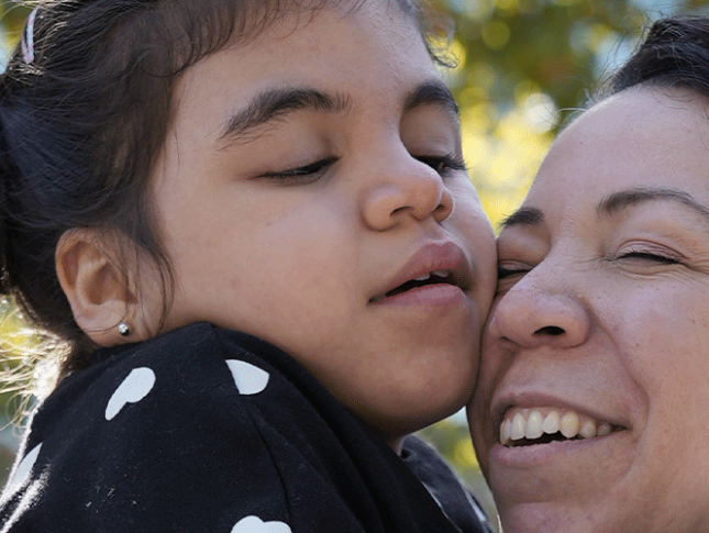 Violet hugs her mom, Inez.