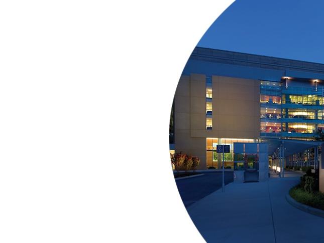 Exterior of Kennedy Krieger's main outpatient building at night.