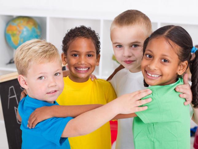 Four children in a pre-k classroom