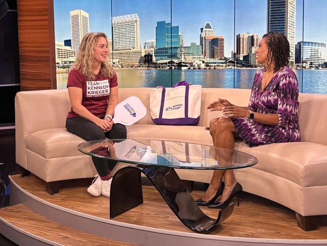 A Kennedy Krieger physical therapist is interviewed in a TV studio.