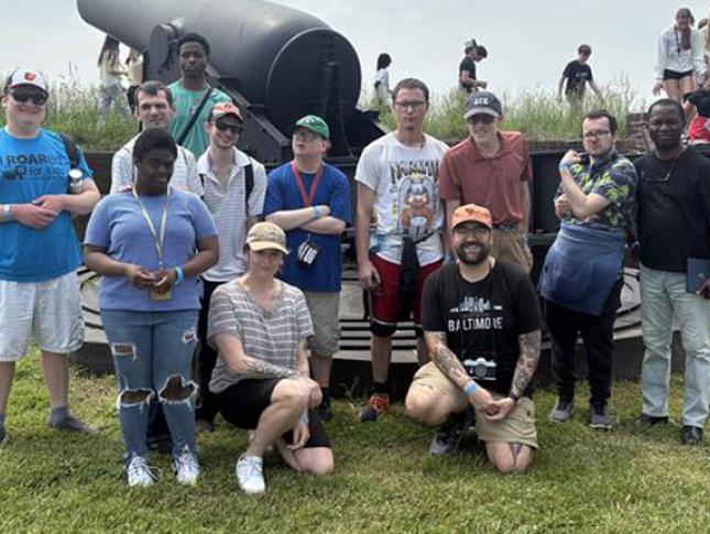 Group photo from a Neurodiversity at Work outing at Fort McHenry in Baltimore.