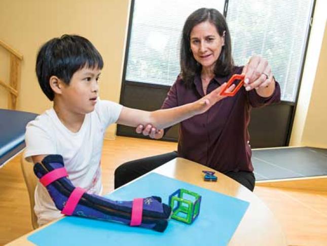 A patient receives physical therapy services at Kennedy Krieger Institute.