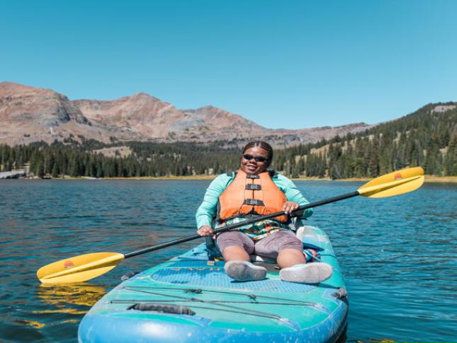 An athlete participates in adaptive kayaking.
