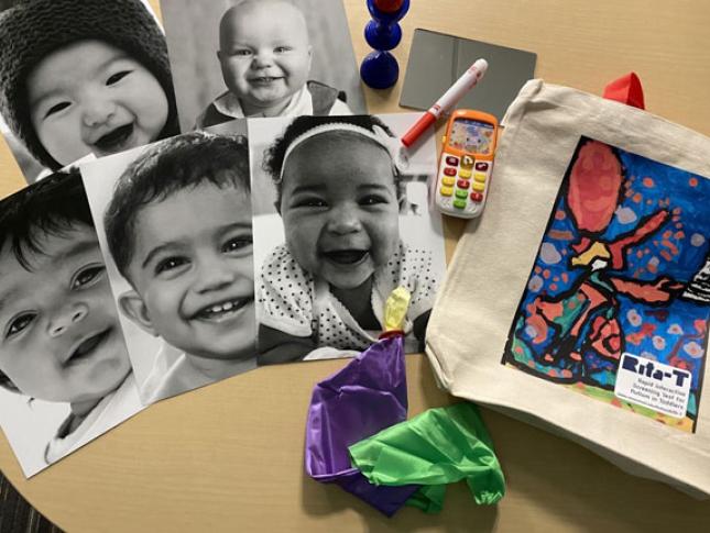 Black and white photos of smiling toddlers on a table with school supplies and a Rita-T canvas bag.
