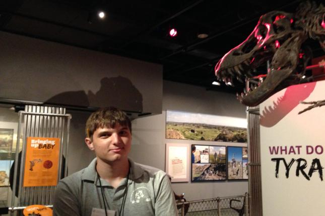 Justin poses with a model of a Tyrannosaurus Rex at the Smithsonian.