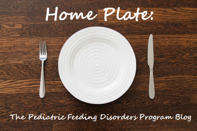 The words "Home Plate: The Pediatric Feeding Disorders Program Blog" appear in white on top of an illustration of a table with a plate, fork, and knife