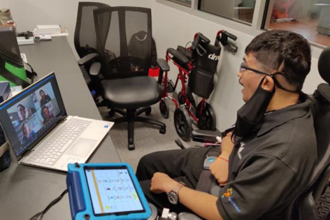 Parth, a Project SEARCH intern, sits at his desk for a meeting over Zoom. 