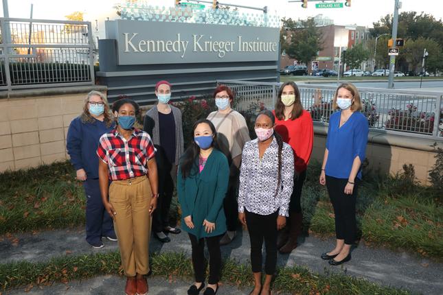 The Pediatric Post-COVID-19 Rehabilitation Clinic team stands in Kennedy Krieger Institute's therapy garden for a photo.