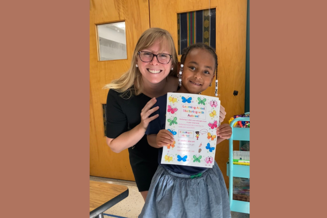 Aubree smiles with Kate Smidl, her speech therapist.