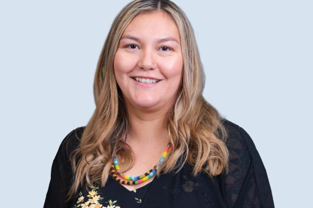 Posed photo of a smiling woman.