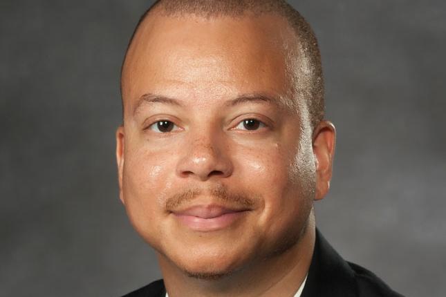 Dr. Natario Couser headshot.