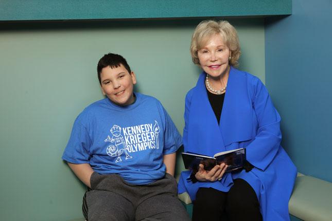Dr. Nancy Grasmick and a student of Kennedy Krieger's Fairmount Campus.