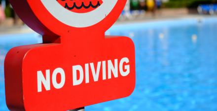 Story about warnings against diving in shallow waters
