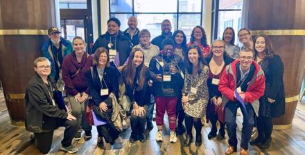 The Neurodiversity at Work team poses for a photo. 