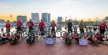 A group of bicyclists smiling.