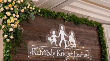 Decorative Kennedy Krieger Institute logo.