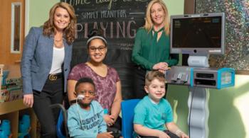 Lisa Vogel and Aimee Fulchino with patients and the Starlight Fun Center