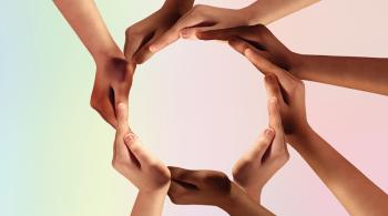 Hands of young children connected to make a circle