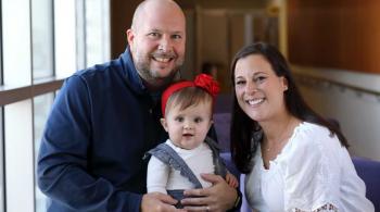 A photo of Josie with her parents